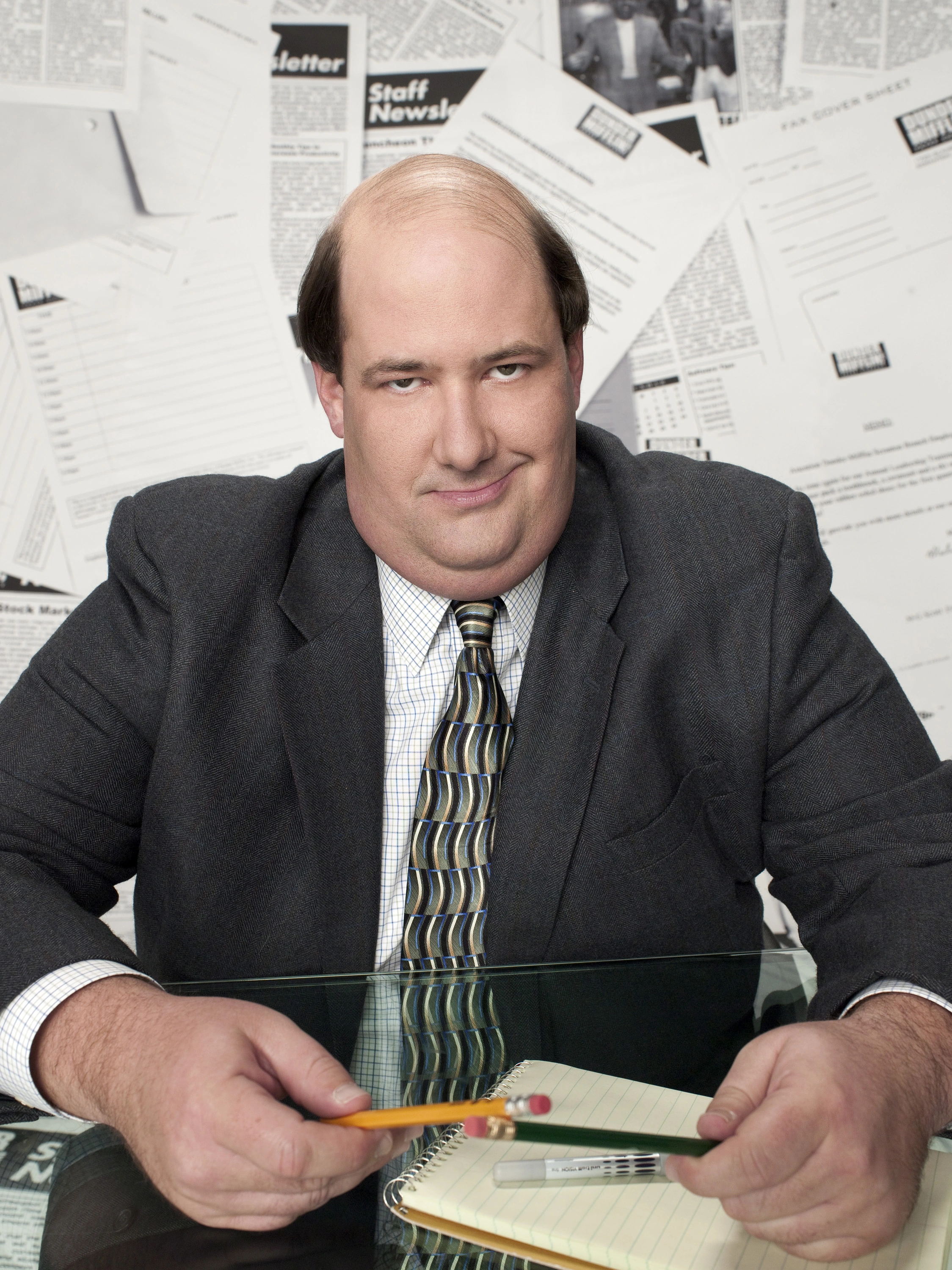 kevin-malone-sitting-at-table